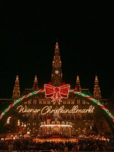 A large christmas light display in front of a building