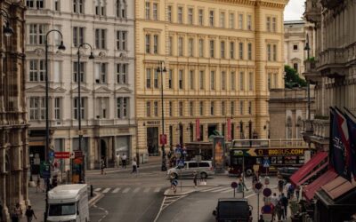 View of busy street in Vienna, Austria with historic buildings and urban life.